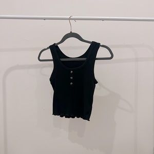 Black tank top with three brown buttons on the front